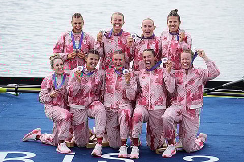 Women's eight rowing final: Canada's team pose after winning Silver